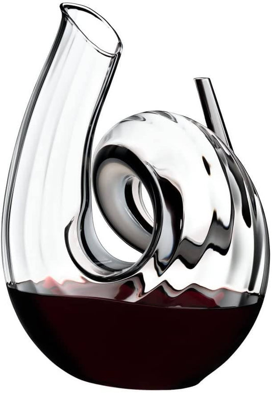 Riedel Decanter Curly Fatto A Mano lets you decant a young bottle of Cabernet for an enhanced flavor. Made from fine crystal, this carafe has a quirky curl shape that is great to use for everyday or a special occasion - 2011/00 Pie's Variety Store