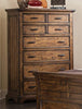 Elk Grove 7-Drawer Chest Vintage Bourbon Collection: Clean And Classic, This Wooden Seven-Drawer Chest Features A Simple Silhouette Enhanced With Raised Details. Store Extra Linens And Clothing Safely With A Variety Of Different Drawer Sizes.  SKU: 203895