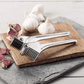 Royal Industries 7 inch Aluminum Garlic Press  This garlic press features pressing nubs that force the garlic through a stainless steel blade. It is extremely easy cleaning and won't leave your hands smelling like garlic all day-ROY GP Hannah's Variety Store