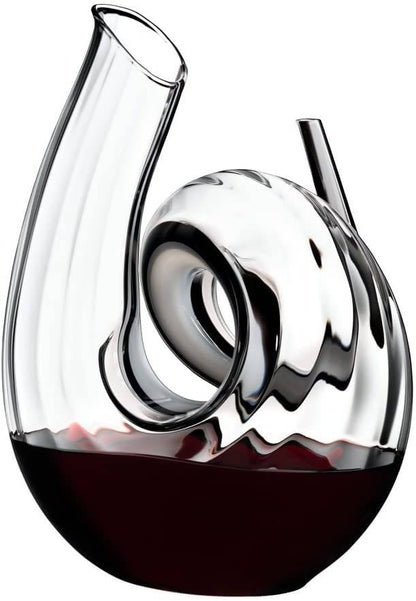 Riedel Decanter Curly Fatto A Mano lets you decant a young bottle of Cabernet for an enhanced flavor. Made from fine crystal, this carafe has a quirky curl shape that is great to use for everyday or a special occasion - 2011/00 Pie's Variety Store